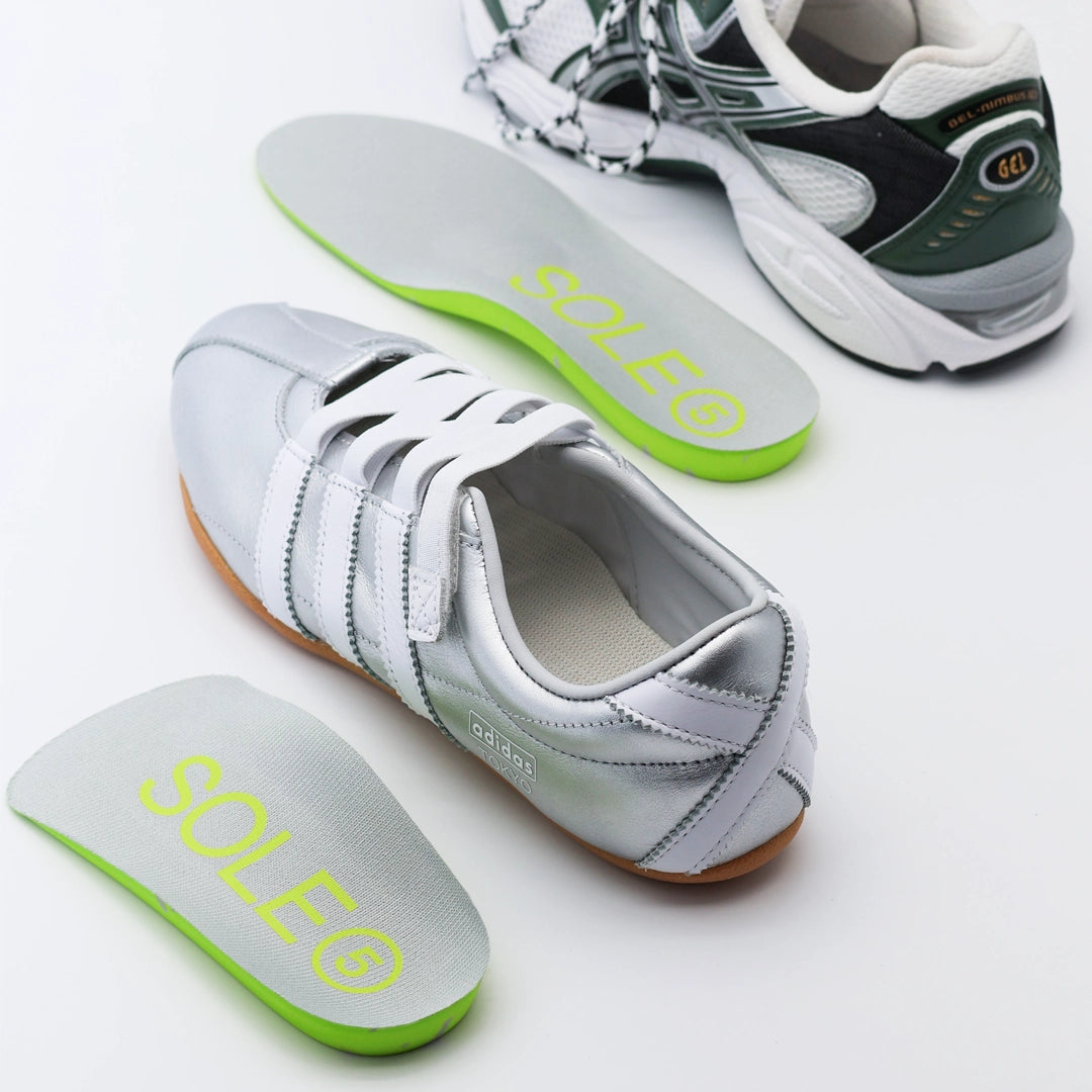 Silver casual shoe and green athletic shoe with a SOLE5 Full  Length & Half Length Orthotic Insole placed next to them.