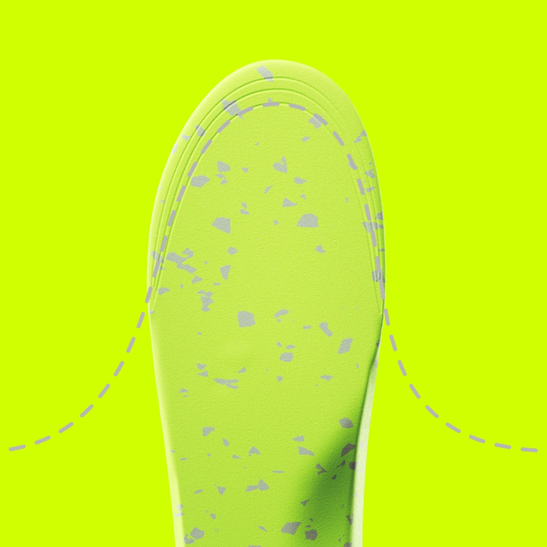 Close up of a sole5 orthotic portaying trimming the length with on a bright yellow background