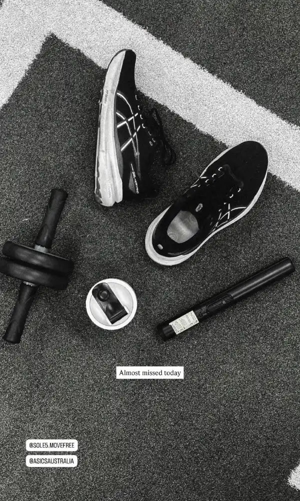 A pair of black and white running shoes arranged on gym flooring, alongside equipment. Text at the bottom reads 'Almost missed today' with SOLE5's social media handles.